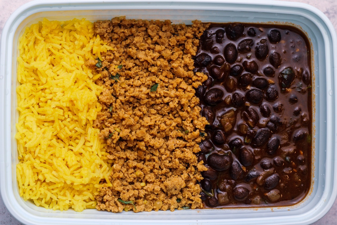 Organic ground turkey, yellow turmeric rice, and black beans